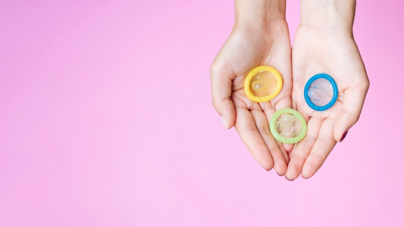 Top View Woman Holding Colourful Condoms 23 2148259684