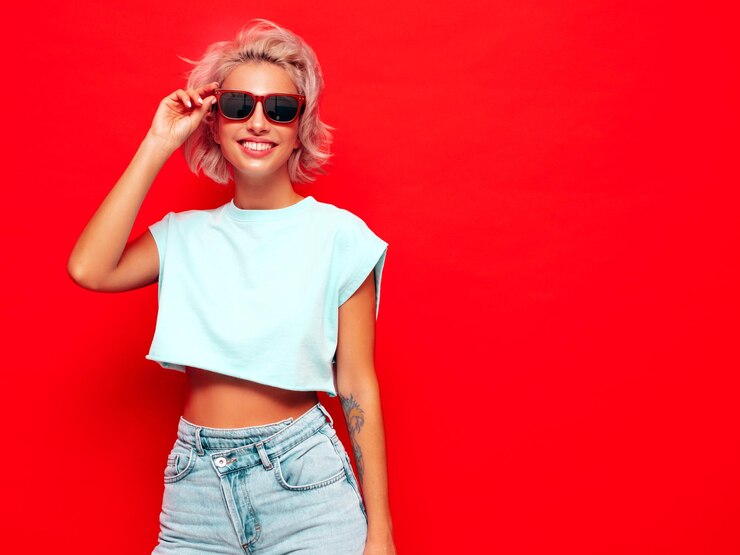 Young Beautiful Smiling Female Trendy Summer Clothes Sexy Carefree Woman Posing Near Red Wall Studio Positive Blond Model Having Fun Going Crazy Cheerful Happy Sunglasses 158538 20608